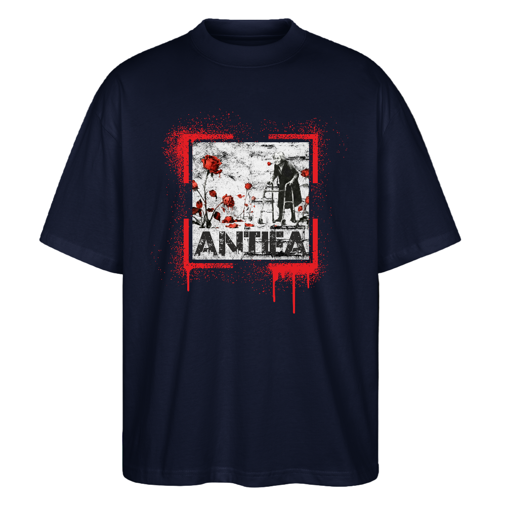 Navy oversized tee with red paint splatter frame, elderly person with walker and red roses; ANTHEA below.