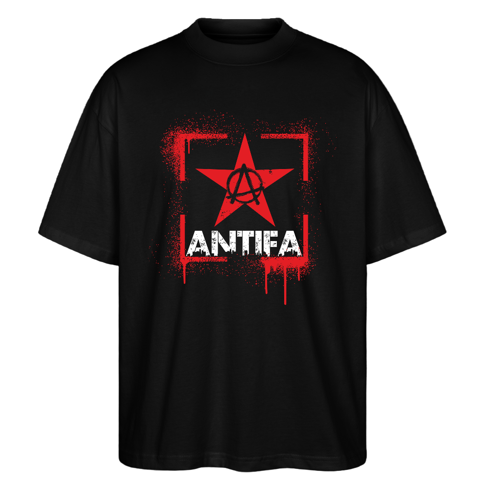 Front view black T‑shirt showing red spray‑paint rectangle with central star containing encircled A and bold distressed white “ANTIFA” print below.